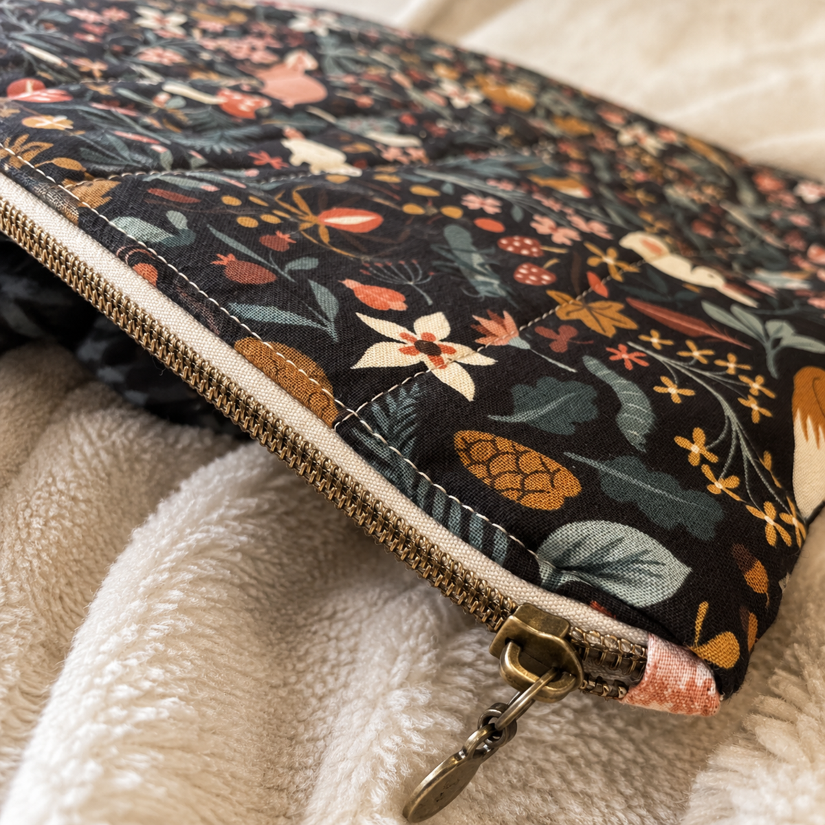 Handmade dark floral MacBook sleeve with zipper closure