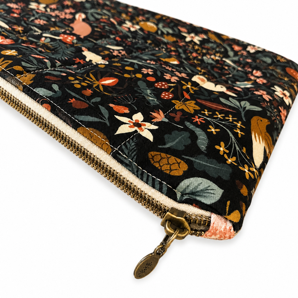 Handmade dark floral MacBook sleeve with zipper closure