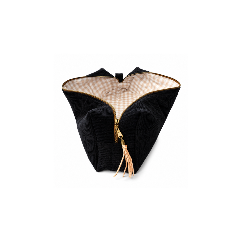 A black corduroy cosmetic pouch with a gold zipper and tassel, featuring a beige and white checkered lining, shown on a plain white background. Corduroy hair tool bag for styling tools and cords