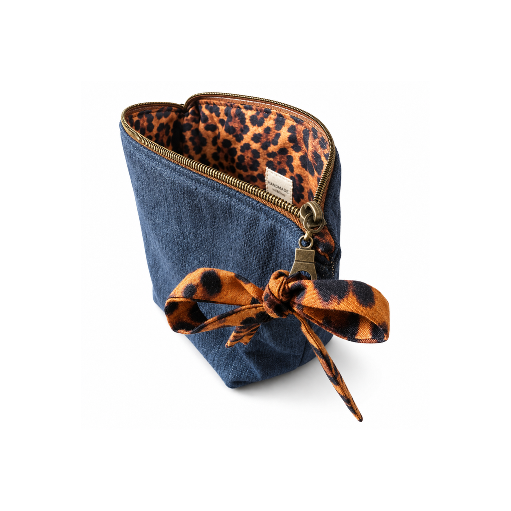 Zippered denim makeup and toiletry bag with animal print lining