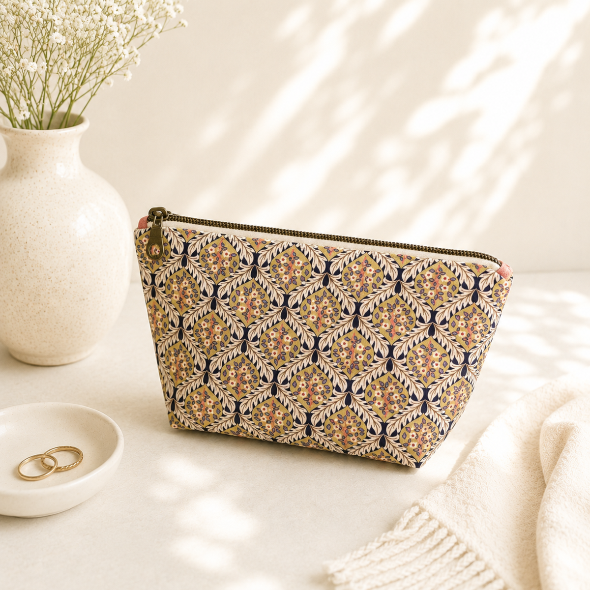 Handmade quilted toiletry bag with floral print