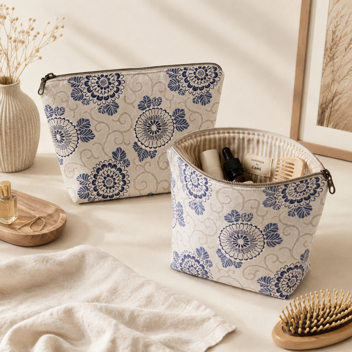 Handmade quilted toiletry bag with blue botanical print with khaki striped lining